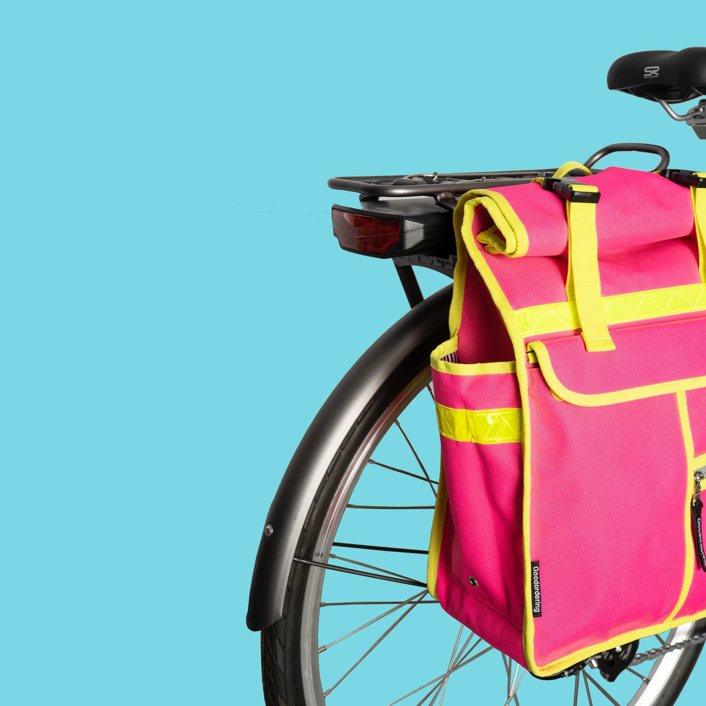 Neon pink rolltop backpack pannier bike bag Rixen kaul hardware hooks