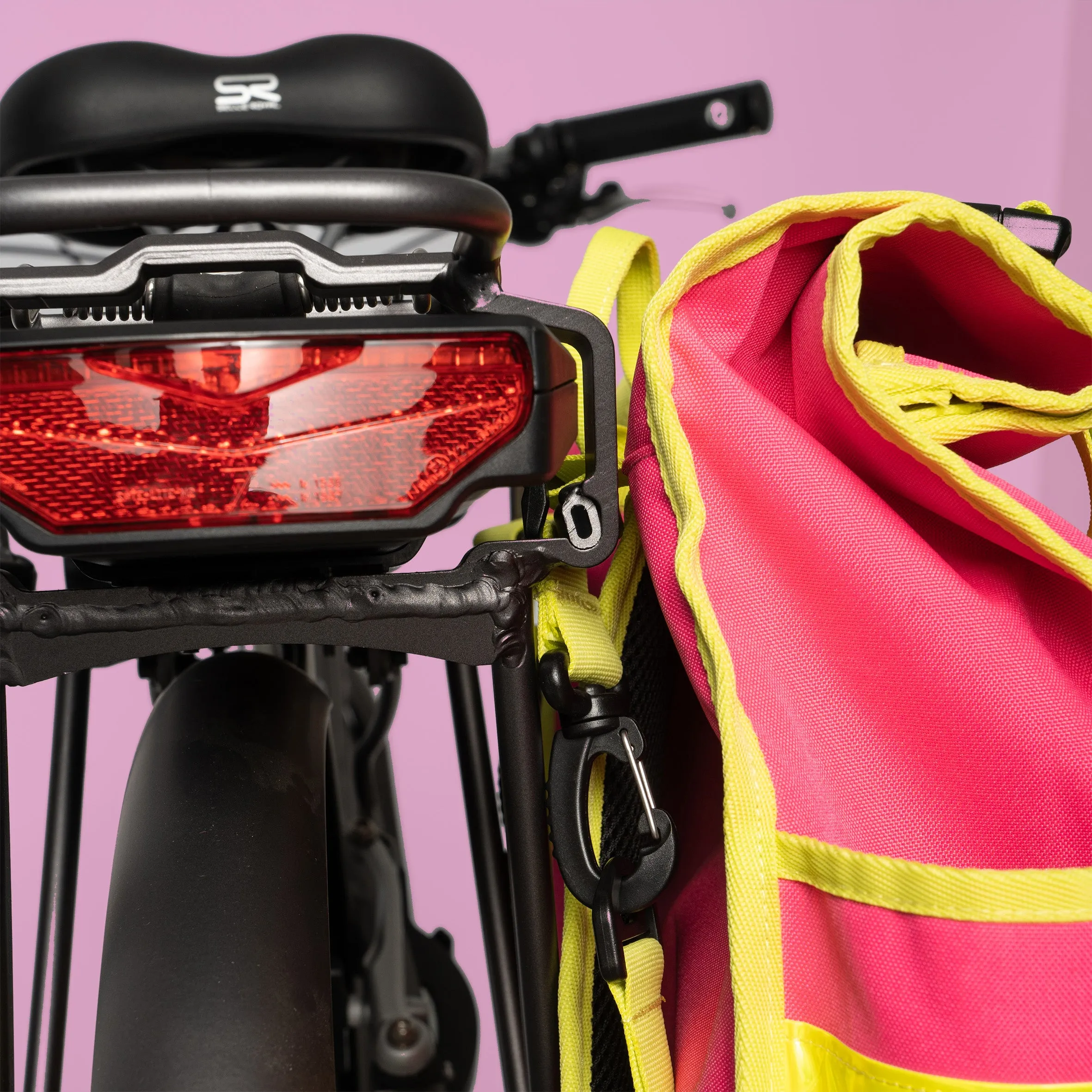 Neon pink rolltop backpack pannier bike bag Rixen kaul hardware hooks